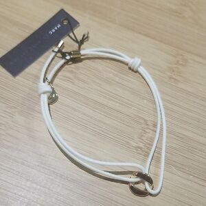 Elegant White and Gold Bracelet
